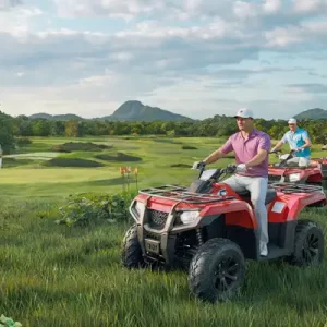 Group of golfers enjoying ATV rides and archery activities in Thailand, highlighting Fairways of Eden’s adventurous offerings apart from golf.
