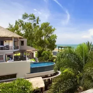 Breathtaking sea view from Aleenta Resort & Spa, featuring luxurious villas and an infinity pool overlooking the ocean.