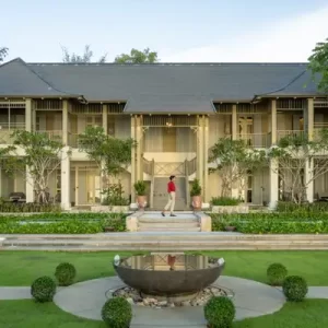 Elegant facade of Charras Bhawan Hotel, a luxurious partner of Fairways of Eden in Hua Hin, Thailand.