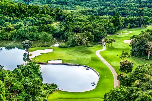 A stunning aerial view of Laem Chabang International Country Club, showcasing lush fairways, water hazards, and rolling greens. A premium golf partner of Fairways of Eden in Pattaya.