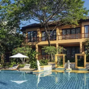 Luxurious pool and tropical surroundings at Mövenpick Asara Resort & Spa in Hua Hin, offering a relaxing retreat.