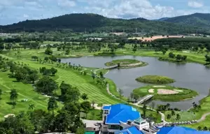 Aerial view of Pattana Sports Resort in Chonburi, showcasing lush fairways, water hazards, and modern facilities.