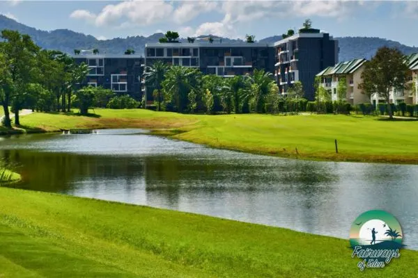 Laguna Golf Phuket – lakeside fairway with modern resort buildings and mountain views at this leading Phuket golf course in Thailand