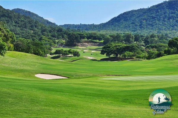 Wide fairway at Black Mountain Golf Club set in a green valley with surrounding mountains