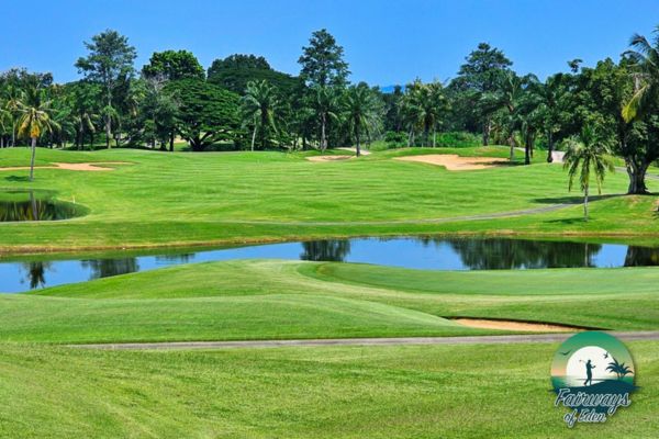 Green complex with water hazard and bunkers at Majestic Creek Country Club in Thailand