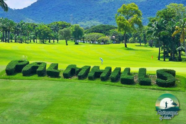 Palm Hills Country Club course name shaped in hedges with fairway and hills behind