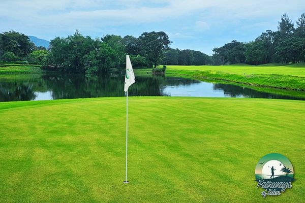 Putting green with water hazard at Springfield Royal Country Club in Thailand