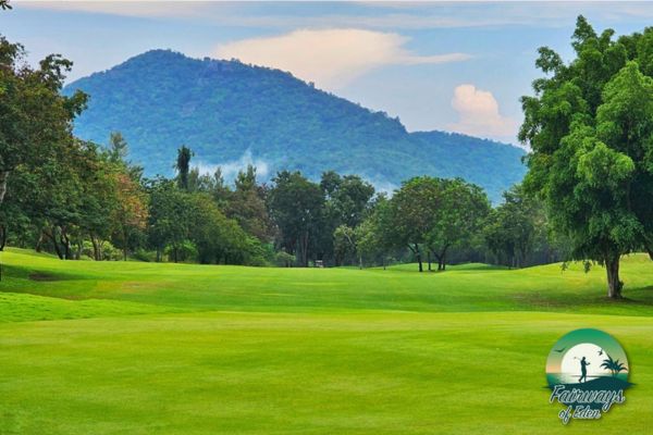 Wide fairway at Springfield Royal Country Club with mountain backdrop and lush greenery